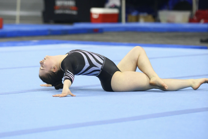 On her floor routine, Sawyer Whitcher poses as part of her choreographed routine. Sawyer is a gymnast for both her club and the school team.